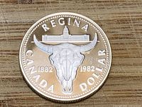 Reverse showing cattle skull, dates 1882-1982, REGINA legend