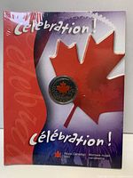 Front of shrink-wrapped presentation folder with encapsulated coin visible