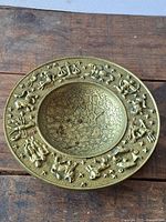 Top view showing full brass bowl with zodiac relief