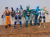 Front view of five action figures standing in a row