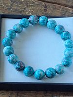 Full view of circular bracelet showing all beads