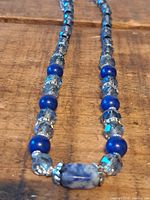 Full view of necklace showing bead pattern and focal stone