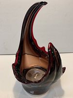 Overall view of freeform hand-blown art glass vase showing color gradient and sculptural shape