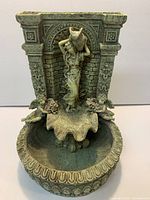 Front view of polyresin fountain showing lady, cherubs, arch, basin