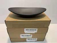 Single matte black oval bowl displayed on top of three individual product boxes