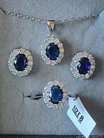 full view of necklace, earrings, ring in box