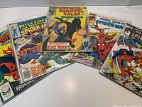 Group shot of all five bagged comics