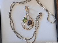 Full view of sterling chain and gemstone pendant
