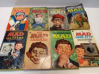 All eight MAD paperback books arranged in two rows
