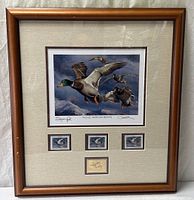 Full view of framed print with stamps