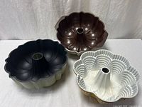 All three Bundt pans top view