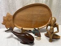 Group shot of all four wooden décor pieces