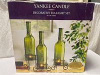 Retail box showing product name and images of the three bottle holders