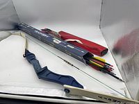 Overall view of recurve bow, quiver, arrow box, and arrows