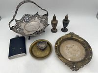 All seven metal items arranged together