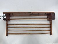 Front view of rack showing hooks and dowels