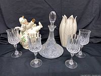 All items in lot: Santa teapot, leaf vase, decanter, four glasses