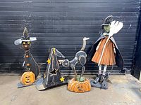 Group shot of all four weathered wood and metal Halloween figures