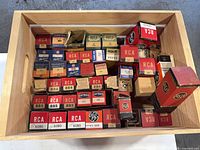 Drawer containing numerous boxed vacuum tubes from brands RCA, GE, Raytheon, Tung-Sol, NU, Westinghouse