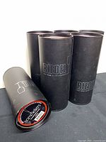 Five of the six black Riedel storage tubes