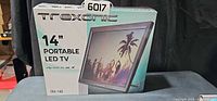 Front of retail box showing Trexonic branding and 14" Portable LED TV label