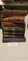 Stack of seven vintage/antique books