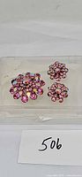 Front view of brooch and both earrings showing pink AB rhinestones