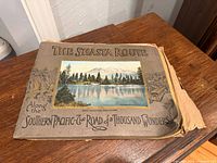 Front cover of oblong softcover book showing title and cover image