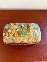 Top view showing Mughal scene on lid