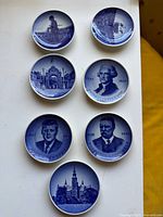 Overview of seven Royal Copenhagen blue mini plates