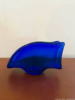 Front view showing cobalt blue glass napkin holder profile