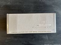Box top showing limited edition die-cast metal collector bank text and vehicle silhouette