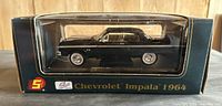 Front view of boxed 1964 Chevrolet Impala diecast model