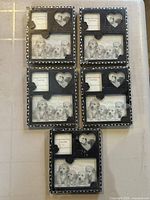 All five sealed black dog photo frames displayed front view