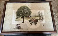 Overall view of framed print showing countryside scene and frame