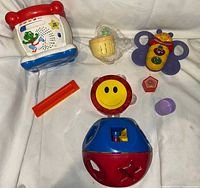 All seven toddler toys arranged together