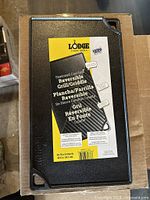 Front view showing Lodge label on reversible grill/griddle