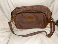Brown fabric bag with leather trim front view
