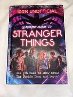 Front cover of the Ultimate Guide to Stranger Things book