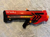 Right side view of red/black Nerf Rival Zeus MXV-1200 with loaded magazine