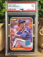 Front view of PSA-slabbed 1987 Leaf Greg Maddux card showing grade label