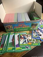 Open 1989 Score NFL Football box showing stacks of colored trading cards.