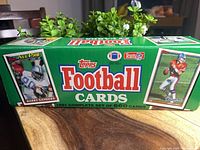 Front of green 1991 Topps Football factory box showing Barry Sanders image
