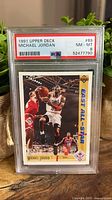 Front of PSA-slabbed 1991 Upper Deck Michael Jordan All-Star #69 card showing action image and PSA label with grade 8