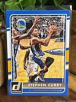 Front of Stephen Curry Donruss card showing action image and player name