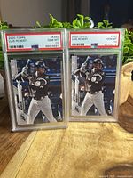 Front view of both PSA-slabbed Luis Robert cards