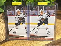 Front view of both Connor Bedard rookie cards in sleeves