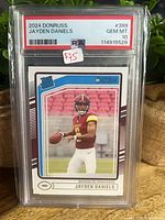 Front of encapsulated 2024 Donruss Jayden Daniels rookie card showing PSA label GEM MT 10