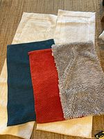 White runners and three bath mats displayed