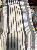 Striped fabric likely duvet cover or shams
